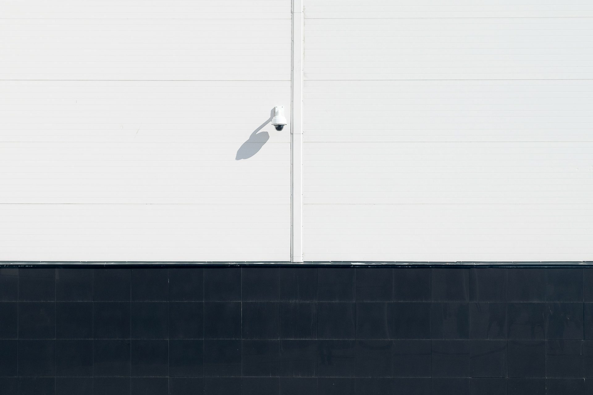a person walking down a street with a skateboard